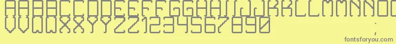 NoxtreyAufTfbLight-fontti – harmaat kirjasimet keltaisella taustalla