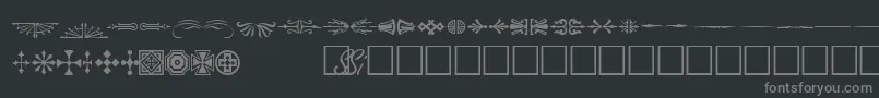 Шрифт WoodcutornamentsonesskRegular – серые шрифты на чёрном фоне