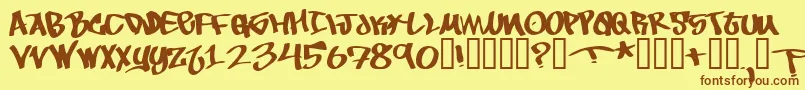 フォントToBeContinued – 茶色の文字が黄色の背景にあります。