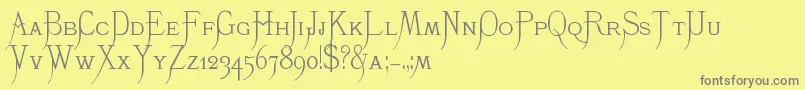 K22Monastic-fontti – harmaat kirjasimet keltaisella taustalla