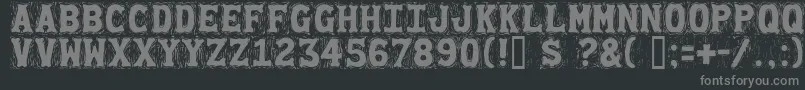 Gommogravure-fontti – harmaat kirjasimet mustalla taustalla