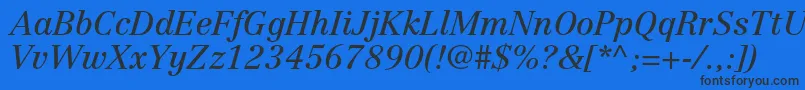 CentennialltstdItalic Font – Black Fonts on Blue Background