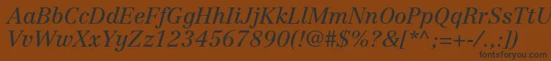 CentennialltstdItalic Font – Black Fonts on Brown Background
