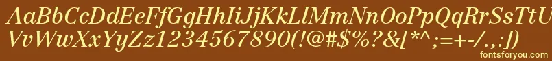 CentennialltstdItalic-fontti – keltaiset fontit ruskealla taustalla