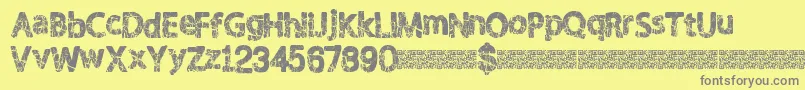 Shaken-fontti – harmaat kirjasimet keltaisella taustalla