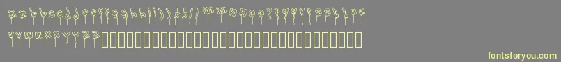 Fonte LolipopFont – fontes amarelas em um fundo cinza