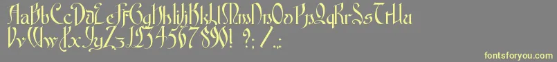 FontenayFancyKk-Schriftart – Gelbe Schriften auf grauem Hintergrund