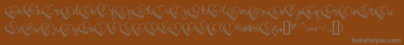 Candyheart-Schriftart – Graue Schriften auf braunem Hintergrund