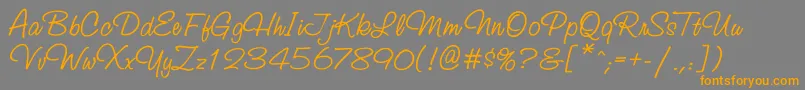 Studioscriptgtt-Schriftart – Orangefarbene Schriften auf grauem Hintergrund