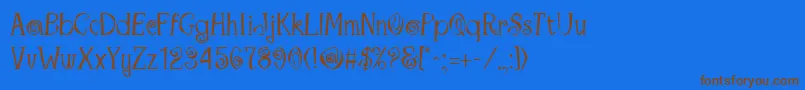 MaracaRegular-Schriftart – Braune Schriften auf blauem Hintergrund