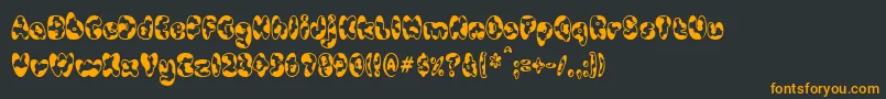 フォントCowpokeBi – 黒い背景にオレンジの文字