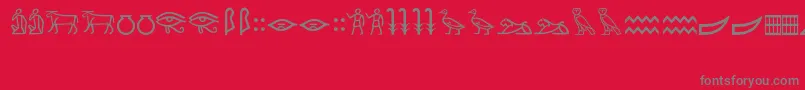Fonte MeroiticHieroglyphics – fontes cinzas em um fundo vermelho
