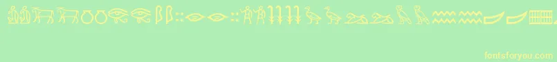 フォントMeroiticHieroglyphics – 黄色の文字が緑の背景にあります