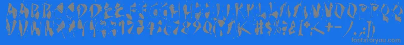 Dekonitials-fontti – harmaat kirjasimet sinisellä taustalla