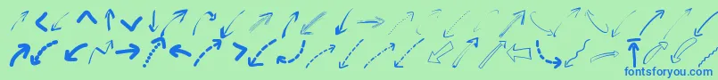 Peaxwebdesignarrows-fontti – siniset fontit vihreällä taustalla