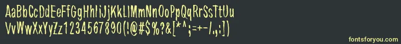 フォントTremoloFlaw – 黒い背景に黄色の文字