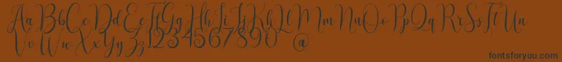 AsyielaDemo Font – Black Fonts on Brown Background