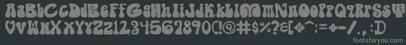 フォントShagadelicBold – 黒い背景に灰色の文字