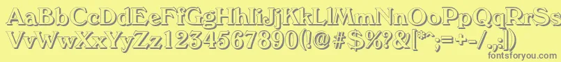 VeronashadowMediumRegular-fontti – harmaat kirjasimet keltaisella taustalla