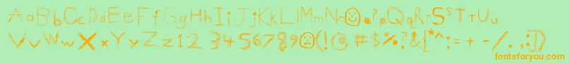 GigglesShits Font – Orange Fonts on Green Background