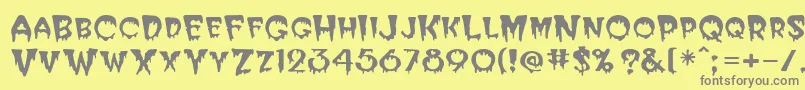 PostcryptMedium-fontti – harmaat kirjasimet keltaisella taustalla