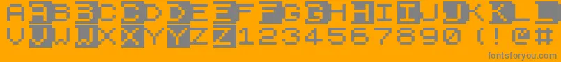 Zx81-Schriftart – Graue Schriften auf orangefarbenem Hintergrund