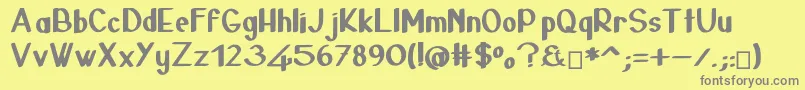 24janvier-fontti – harmaat kirjasimet keltaisella taustalla