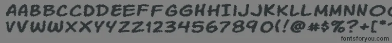 KomikaTread-Schriftart – Schwarze Schriften auf grauem Hintergrund