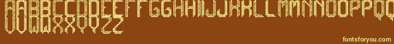 CadabraDebilex-fontti – keltaiset fontit ruskealla taustalla
