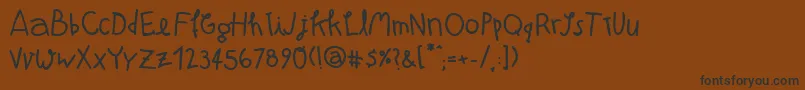 Atmab-Schriftart – Schwarze Schriften auf braunem Hintergrund