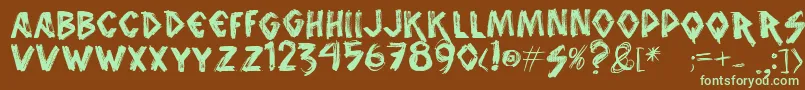 フォントVtksanimal2 – 緑色の文字が茶色の背景にあります。