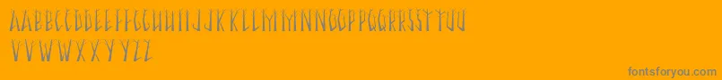 SeasonalTrees-Schriftart – Graue Schriften auf orangefarbenem Hintergrund