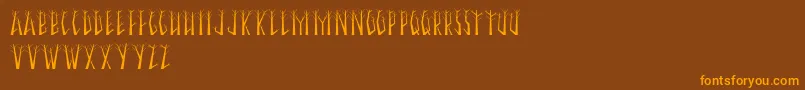 SeasonalTrees Font – Orange Fonts on Brown Background