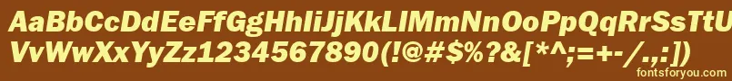 FranklingothheavycttItalic-fontti – keltaiset fontit ruskealla taustalla