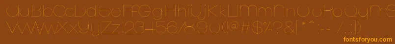 MonofredUltralight Font – Orange Fonts on Brown Background