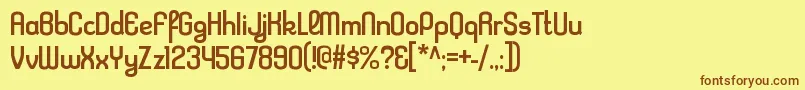 フォントKleptocracyrgRegular – 茶色の文字が黄色の背景にあります。