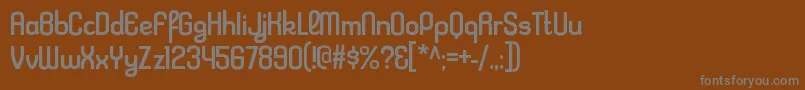フォントKleptocracyrgRegular – 茶色の背景に灰色の文字