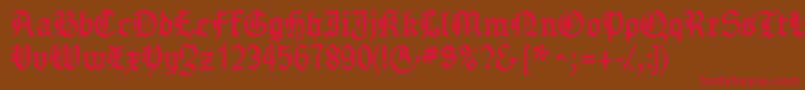 フォントGotenborgfraktur – 赤い文字が茶色の背景にあります。