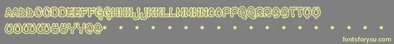 Ravequeen Font – Yellow Fonts on Gray Background