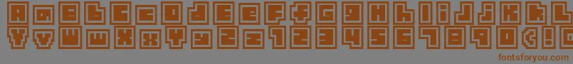 フォントTinyBoxCollagebita12 – 茶色の文字が灰色の背景にあります。