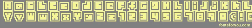 Fonte TinyBoxCollagebita12 – fontes amarelas em um fundo cinza