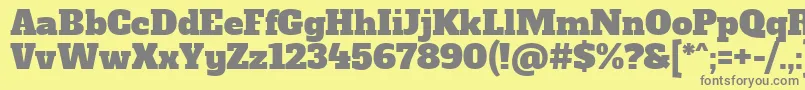 AlfaslaboneRegular-fontti – harmaat kirjasimet keltaisella taustalla