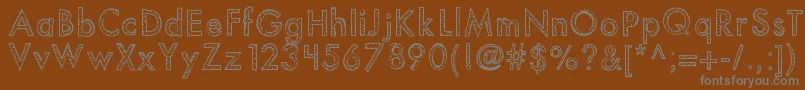 Kbyouvebeenspotted Font – Gray Fonts on Brown Background