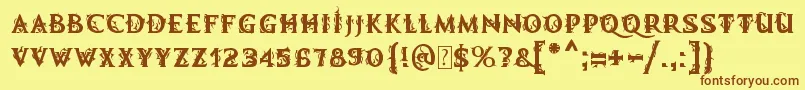 フォントMbDemonicTale – 茶色の文字が黄色の背景にあります。