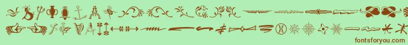 フォントTypeEmbellishmentsThreeLetPlain.1.0 – 緑の背景に茶色のフォント