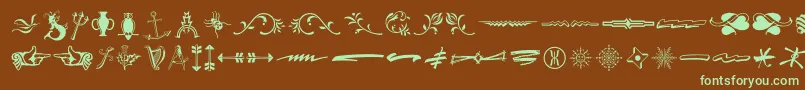 フォントTypeEmbellishmentsThreeLetPlain.1.0 – 緑色の文字が茶色の背景にあります。