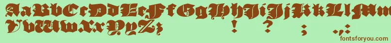 Czcionka JmhMorenetaDivine – brązowe czcionki na zielonym tle