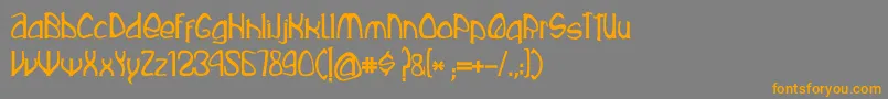 フォントRustika – オレンジの文字は灰色の背景にあります。