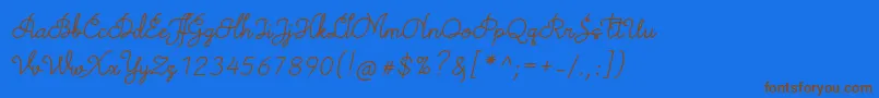 TheodistaDecallyItalic-Schriftart – Braune Schriften auf blauem Hintergrund
