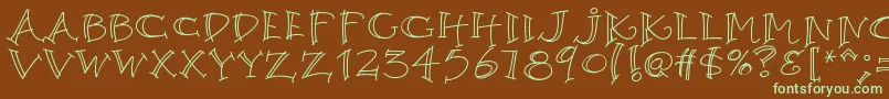 フォントK26argento – 緑色の文字が茶色の背景にあります。